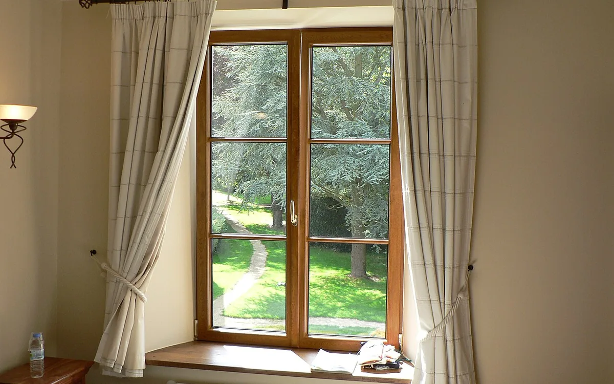 Light curtains around a wooden room window